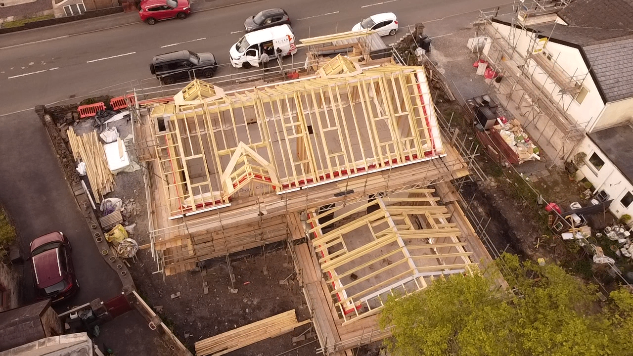 Aerial view of the Rhos build showing roof framing across the property