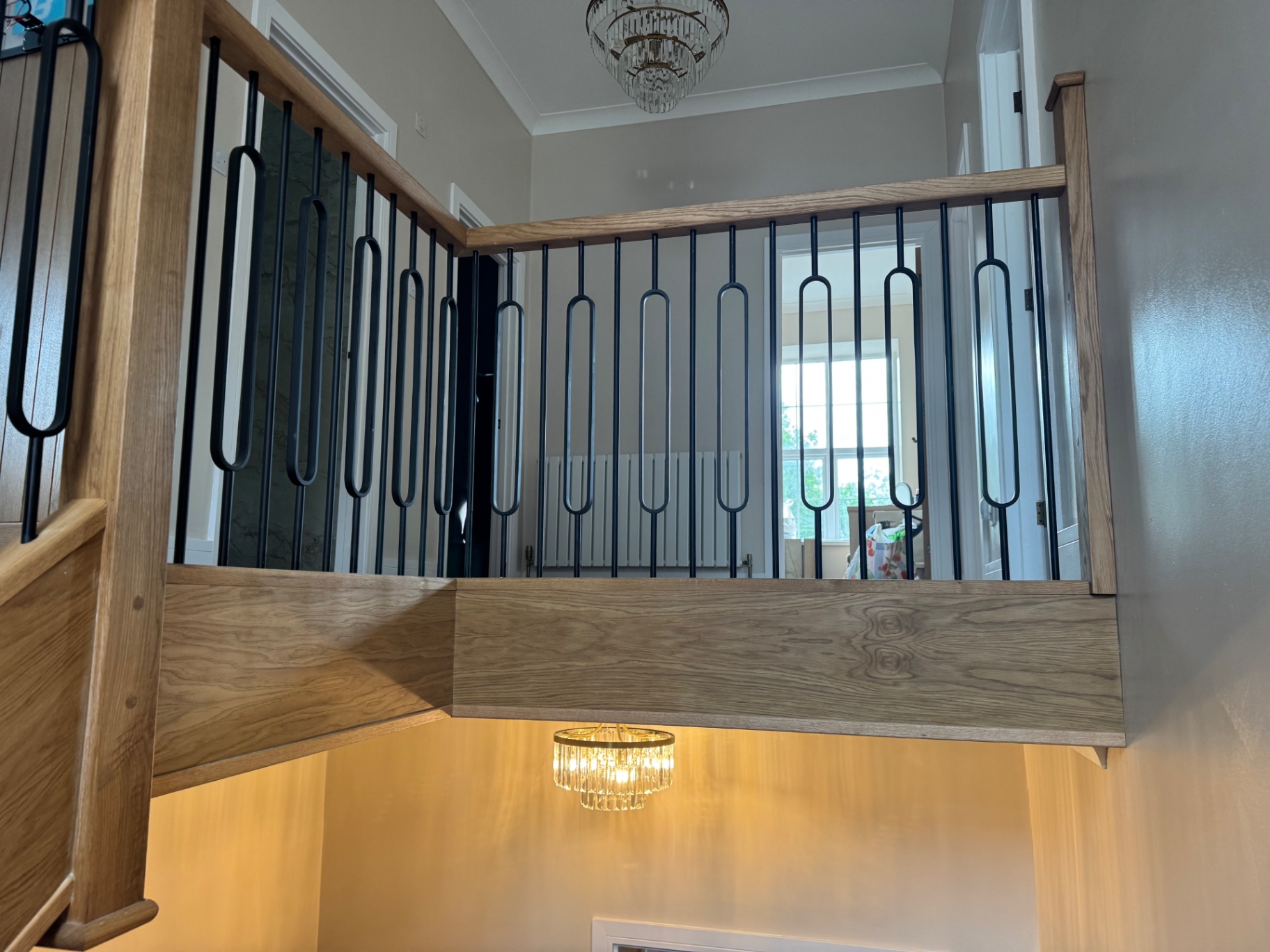 Bespoke oak balustrade with black metal spindles