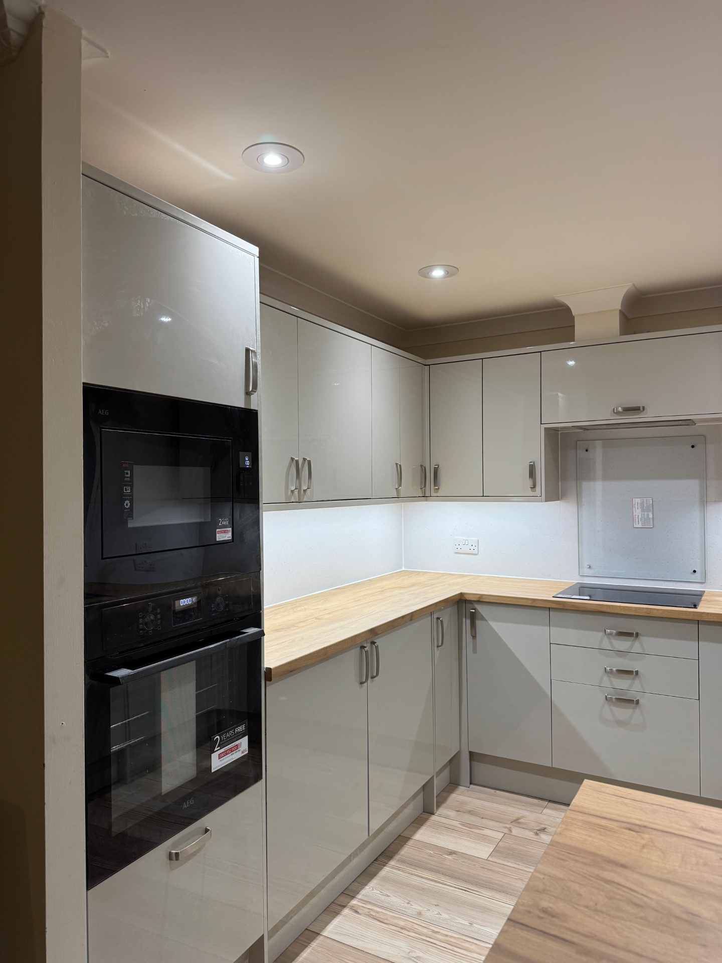 Side view of the Mumbles Reno kitchen showing tall appliance housing and corner cabinetry