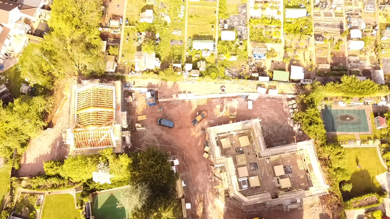 Wide aerial showing Greenway site with houses and block of flats under way