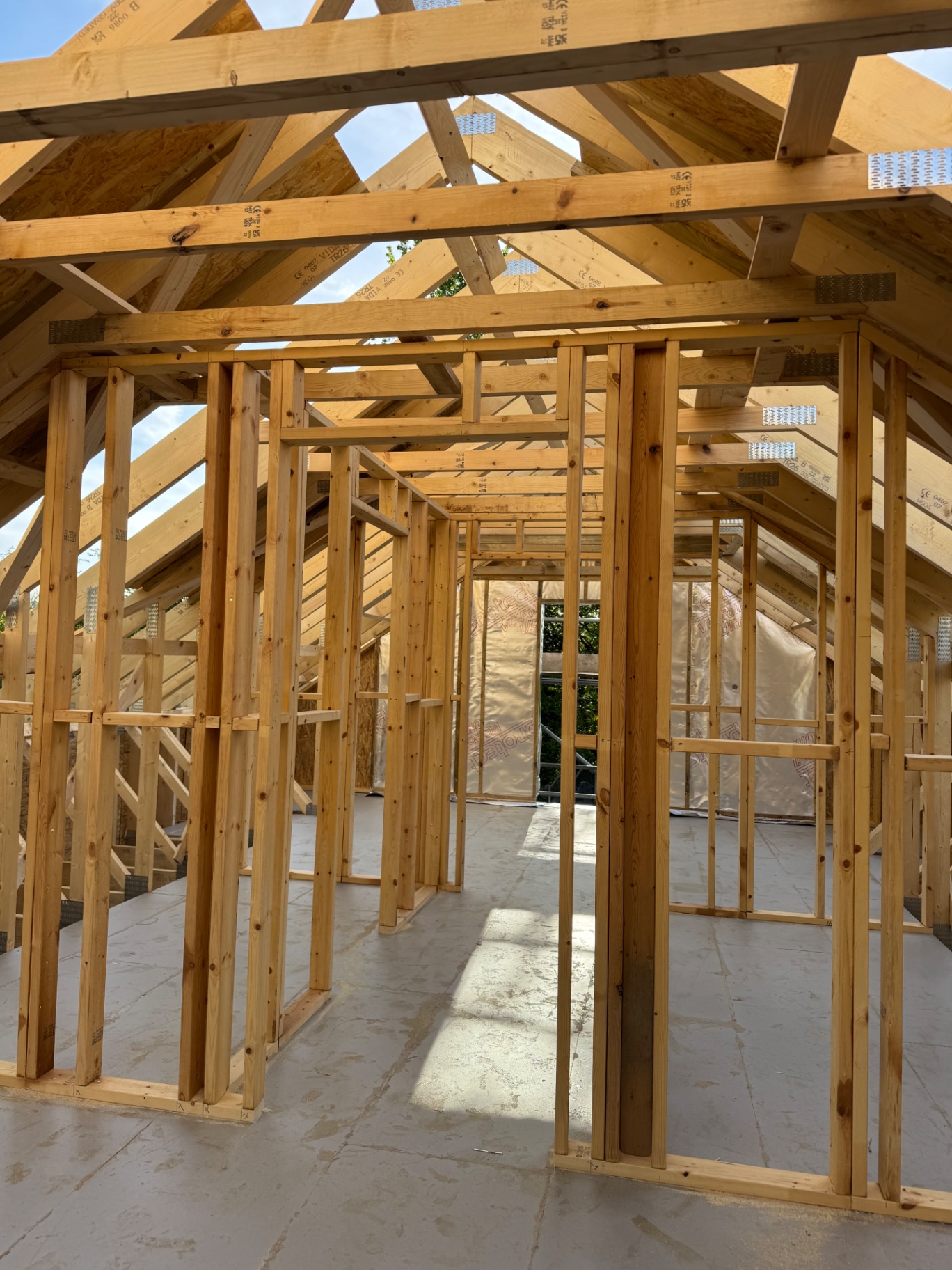 Upper level roof space framing inside the triple garage project