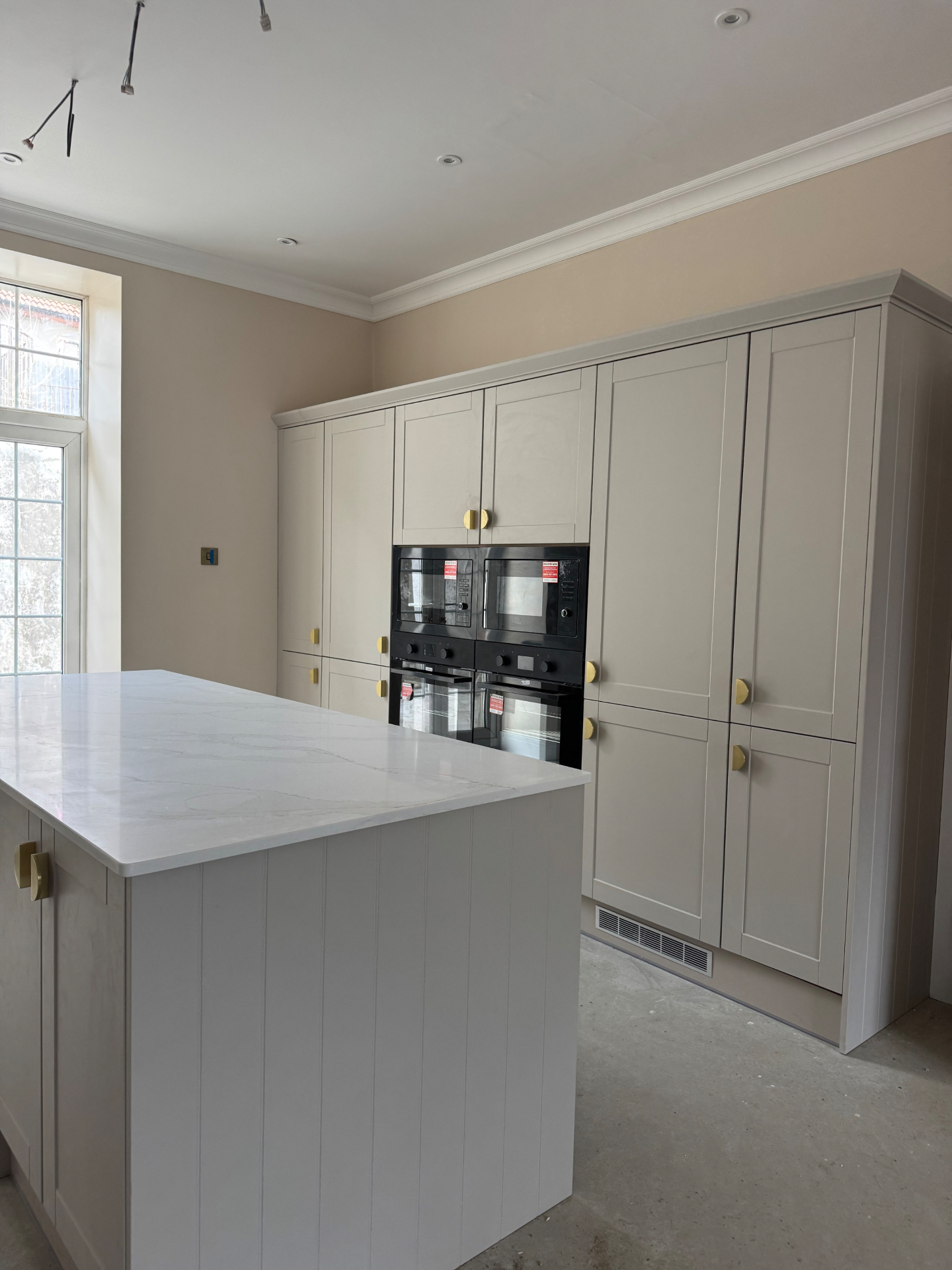 Tall cabinetry and island detail in the Reno project kitchen