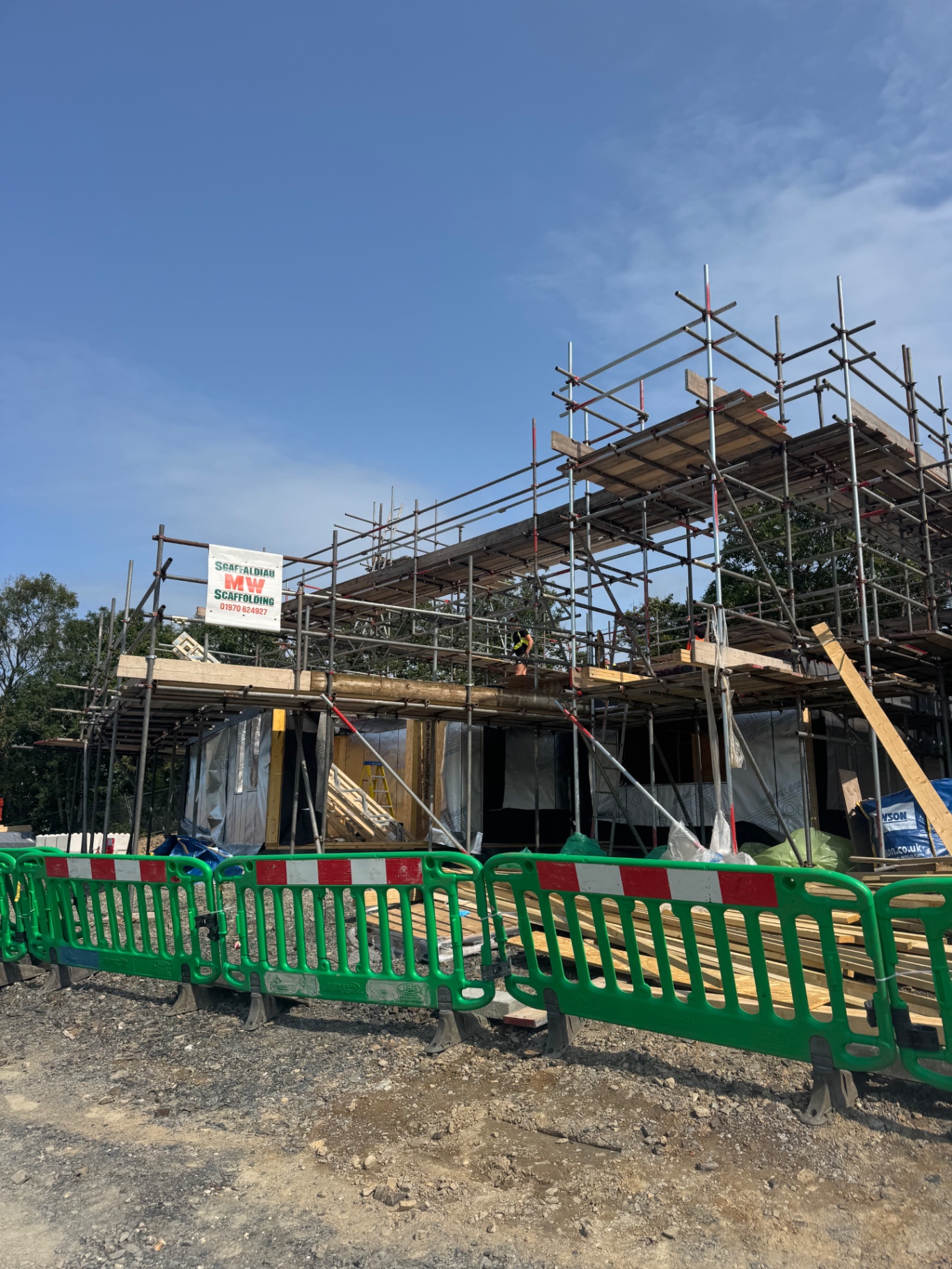 Timber frame and scaffolding on one of the New Quay plots under construction
